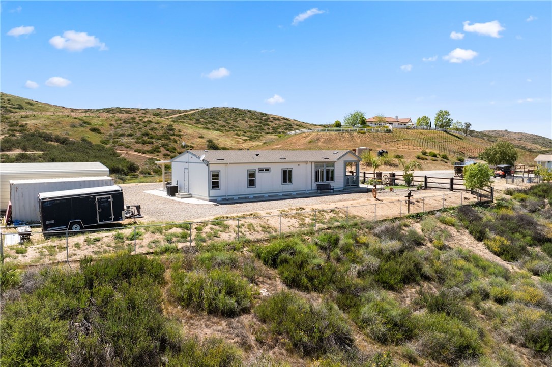 46430 De Portola Road Temecula, CA 92592 - Photo 47 of 61 a view of a large building with a mountain in the background