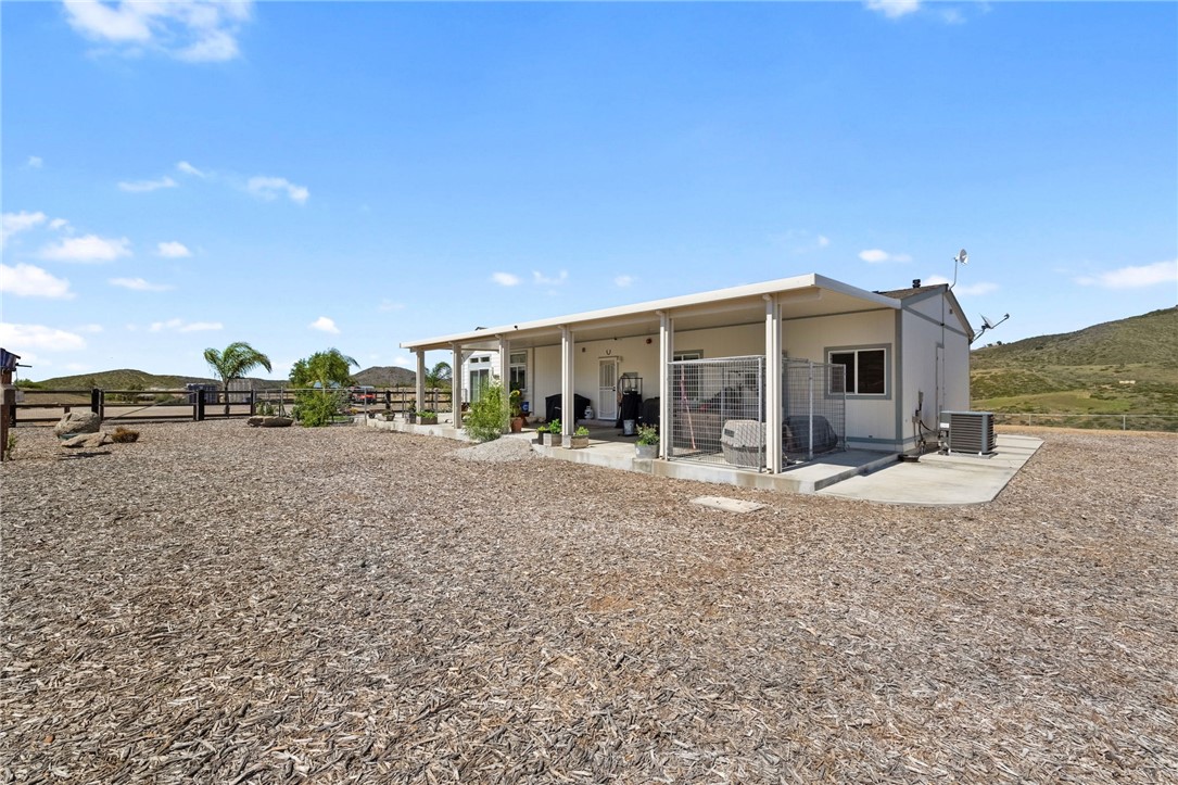 46430 De Portola Road Temecula, CA 92592 - Photo 56 of 61 a view of a house with a yard