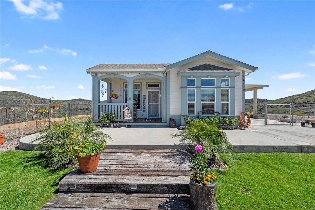 46430 De Portola Road Temecula, CA 92592 - Photo 58 of 61 a front view of a house with yard and green space