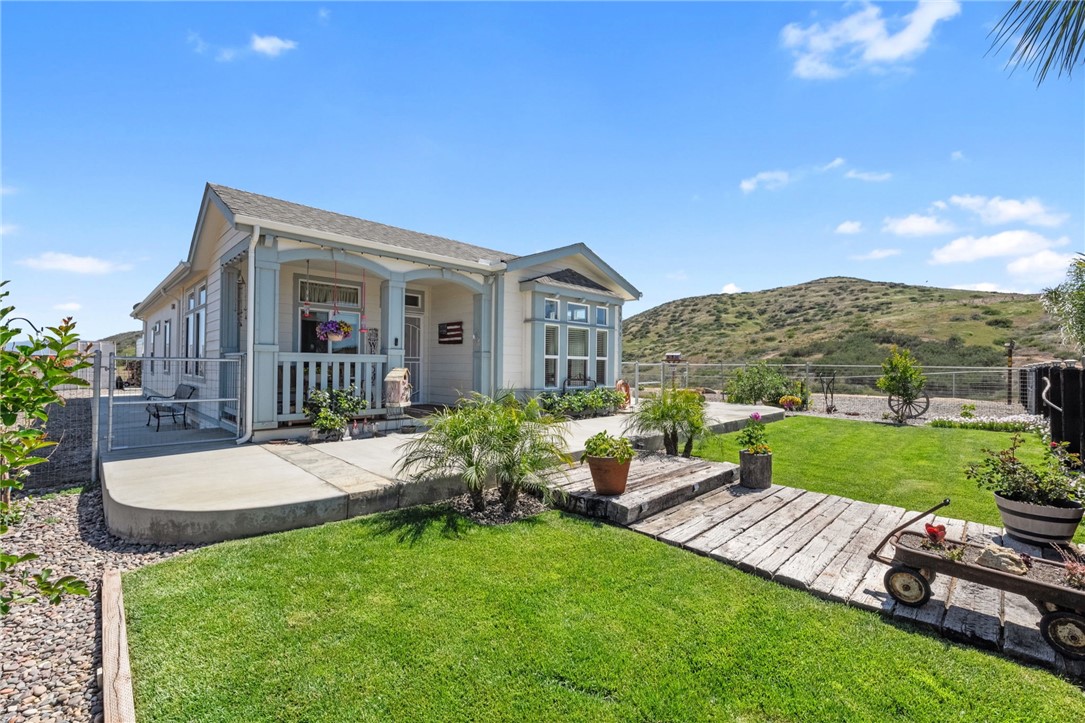 46430 De Portola Road Temecula, CA 92592 - Photo 60 of 61 a view of a house with backyard and porch