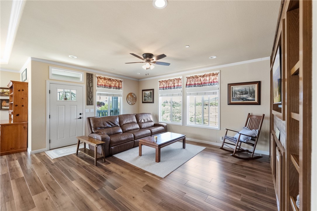 46430 De Portola Road Temecula, CA 92592 - Photo 7 of 61 a living room with furniture and wooden floor