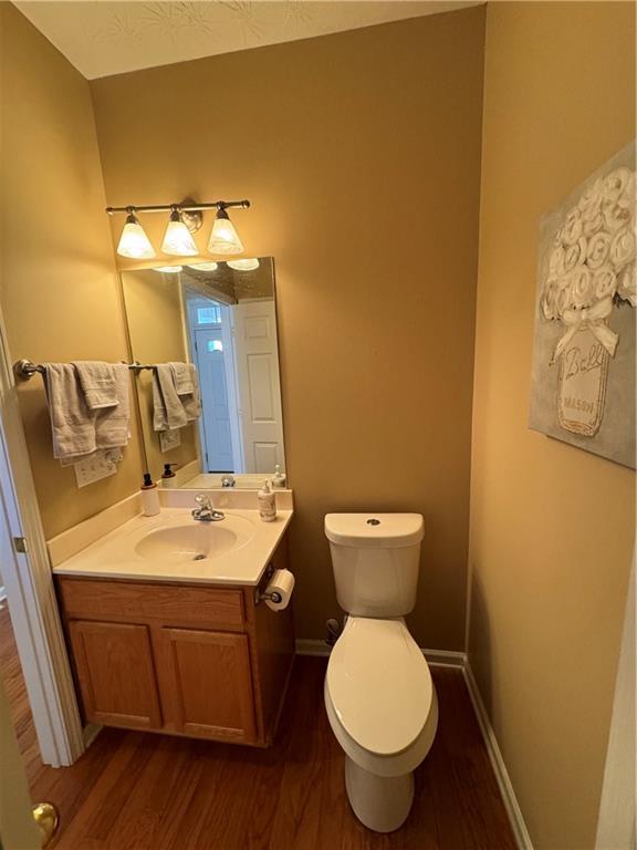 801 Old Peachtree Road Northwest, Unit 8 Lawrenceville, GA 30043 - Photo 11 of 26 a bathroom with a toilet sink and mirror