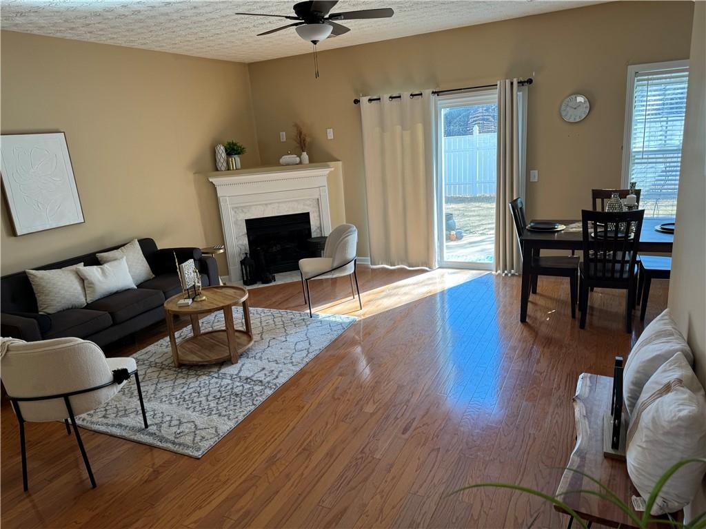 801 Old Peachtree Road Northwest, Unit 8 Lawrenceville, GA 30043 - Photo 18 of 26 a living room with furniture and a fireplace