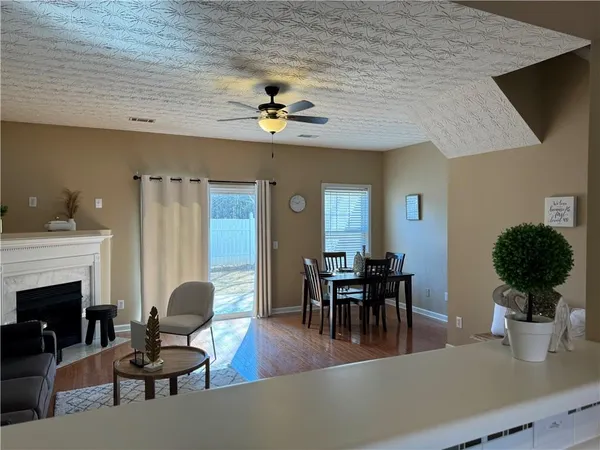 a view of a livingroom with furniture and a potted plant
