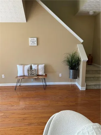 a view of kitchen with furniture and wooden floor