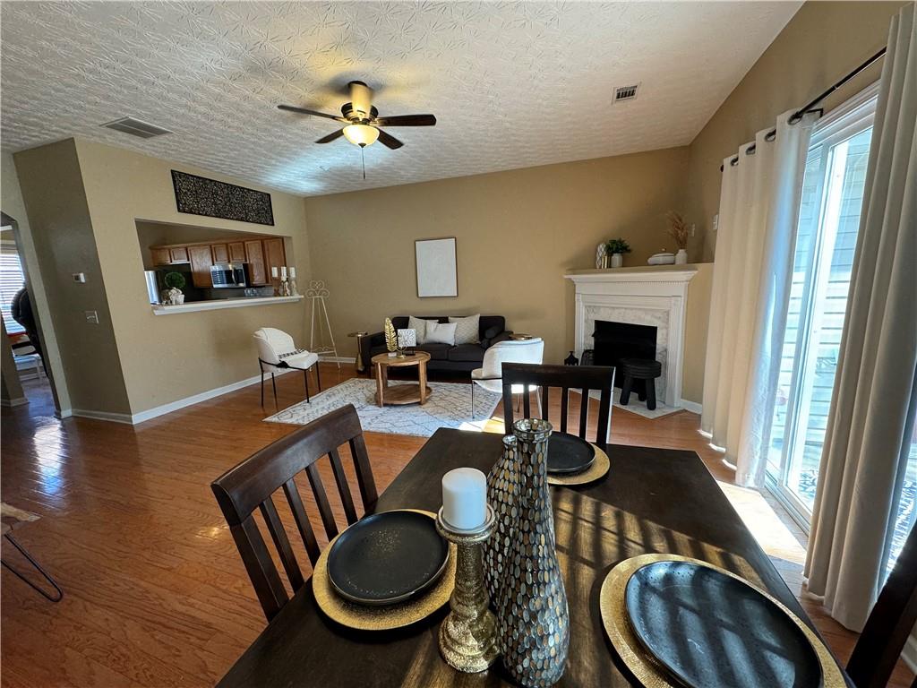 801 Old Peachtree Road Northwest, Unit 8 Lawrenceville, GA 30043 - Photo 5 of 26 a living room with furniture and a fireplace
