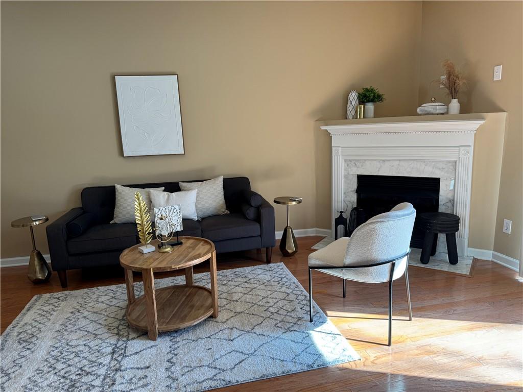 801 Old Peachtree Road Northwest, Unit 8 Lawrenceville, GA 30043 - Photo 6 of 26 a living room with furniture and a fireplace