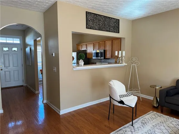 a view of a dining room with furniture and wooden floor
