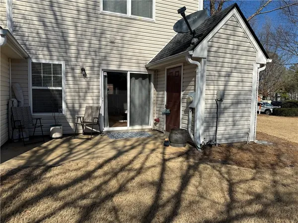 a view of a brick house with many windows