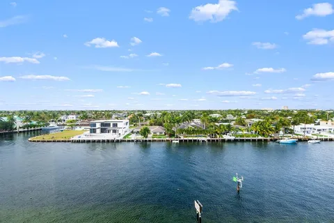 a view of a lake with boats and trees in the background