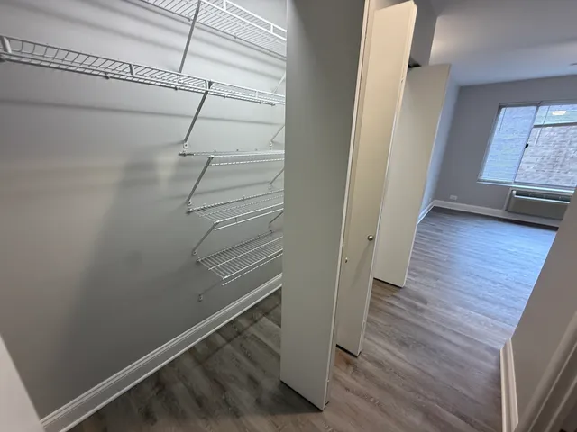 a view of entryway with wooden floor