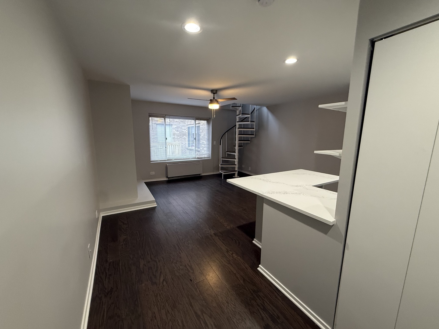 744 West Gordon Terrace, Unit 308 Chicago, IL 60613 - Photo 4 of 15 a room with wooden floor and windows