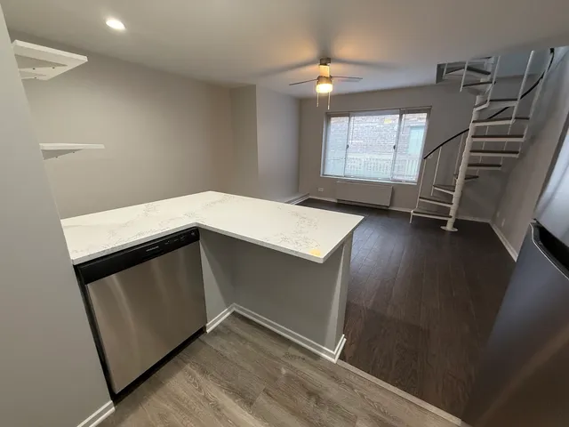 a storage room with window and stairs