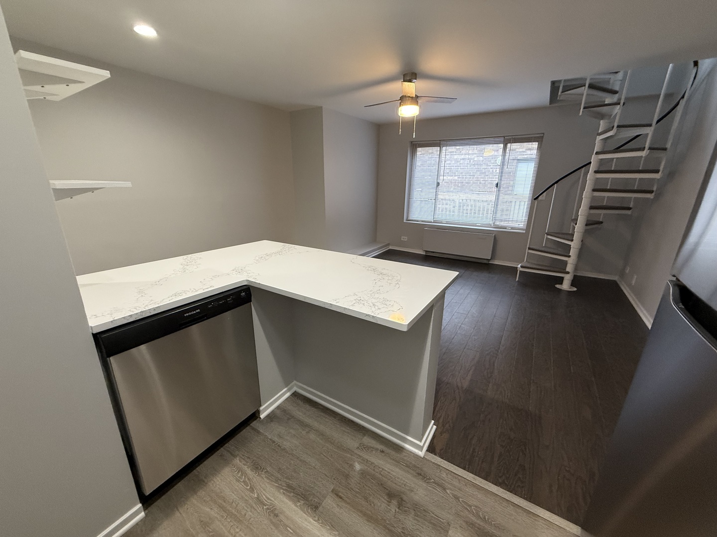 744 West Gordon Terrace, Unit 308 Chicago, IL 60613 - Photo 7 of 15 a storage room with window and stairs