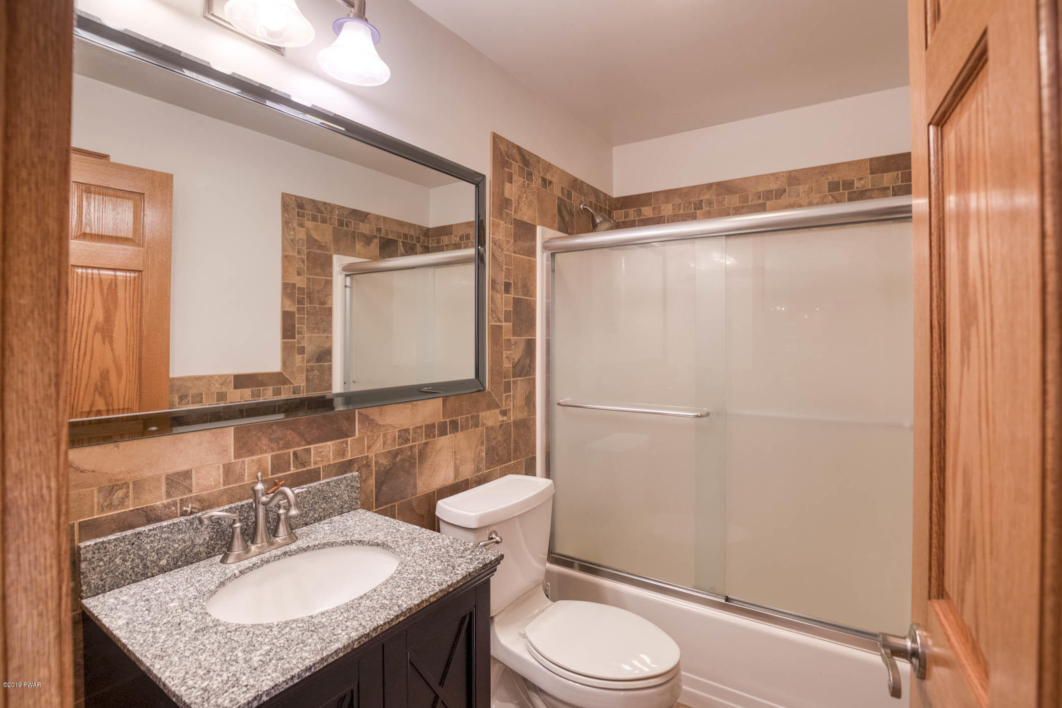 424 Old Gravity Road Lake Ariel, PA 18436 - Photo 19 of 46 a bathroom with a granite countertop sink toilet and shower