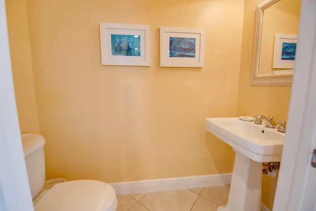 a spacious bedroom with a bed and a large window