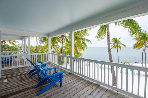 a view of street with wooden fence