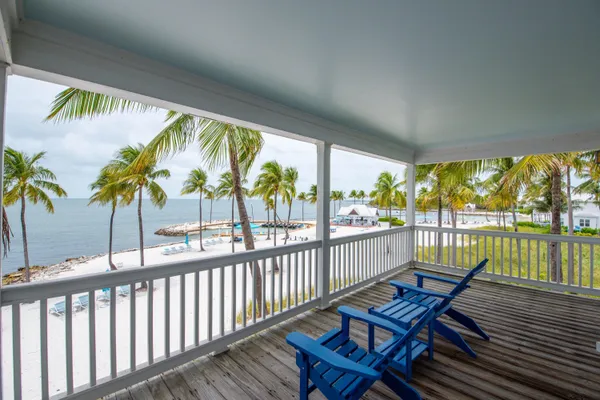 a bedroom with bed and windows