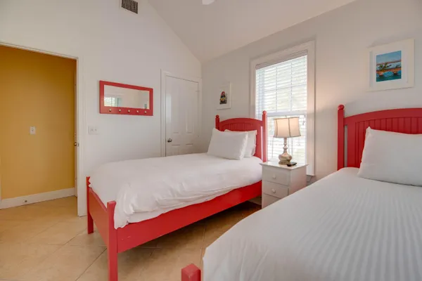 a bathroom with a granite countertop sink toilet and a mirror