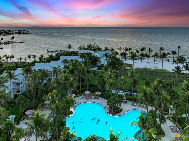 a view of a street with a bench in front of it