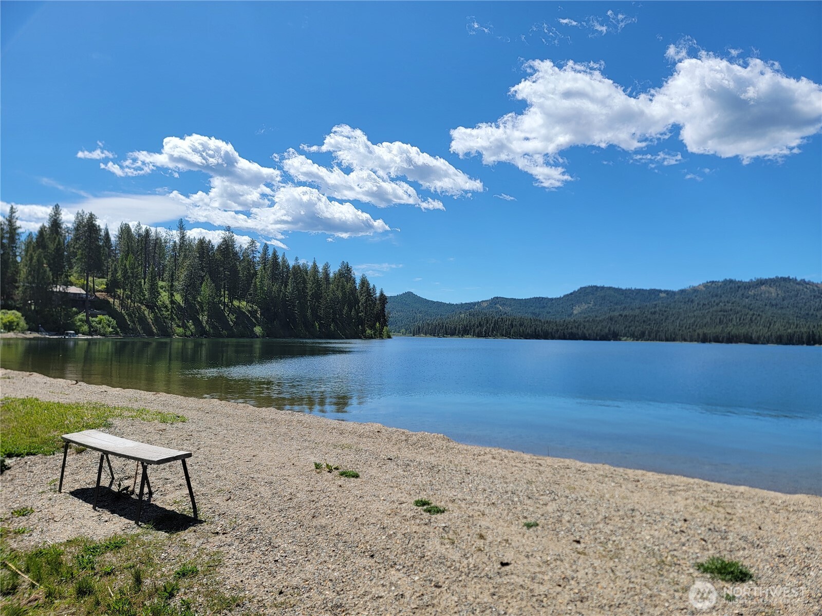 263 Twin Lakes Road Inchelium, WA 99138 - Photo 6 of 11 a view of a lake in between two chairs