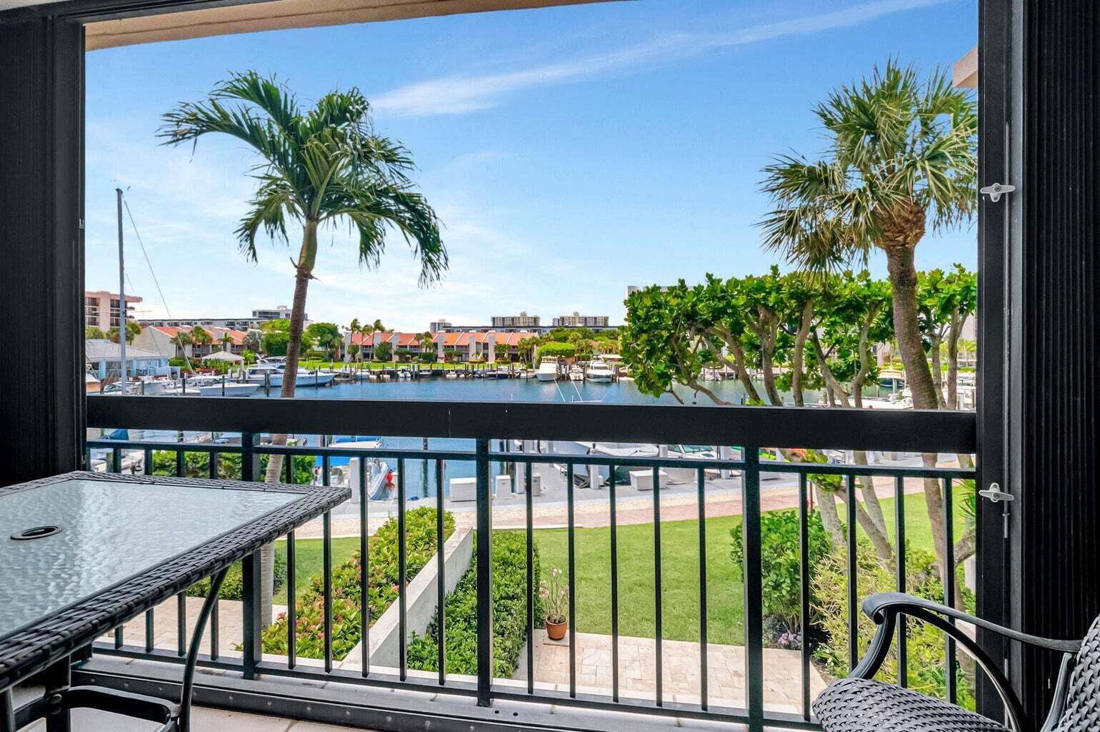 2707 North Ocean Boulevard, Unit D205 Boca Raton, FL 33431 - Photo 11 of 51 a view of a balcony with wooden floor and outdoor space