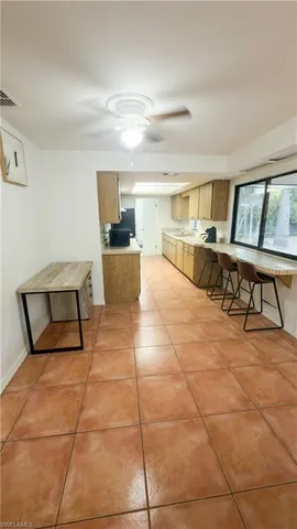 a living room with a furniture and a flat screen tv