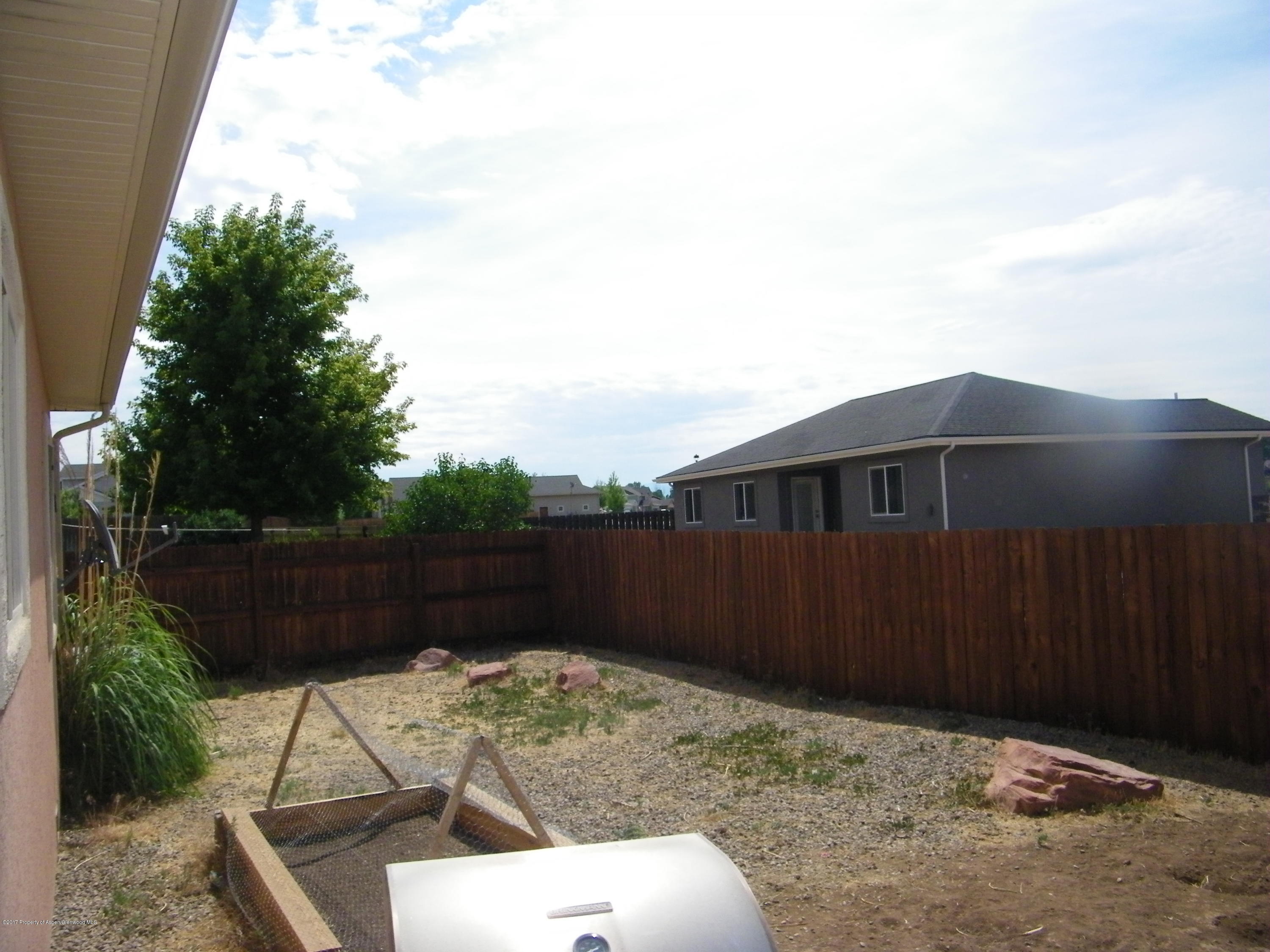 947 East 18th Street Rifle, CO 81650 - Photo 6 of 6 a backyard of a house with lots of green space