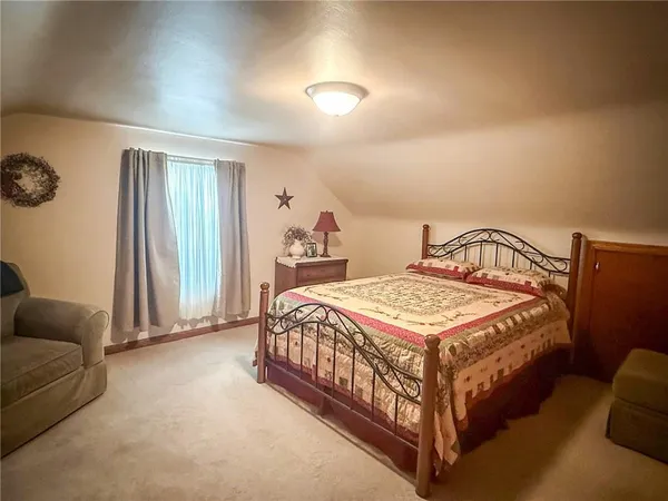 a bed room with a bed and furniture