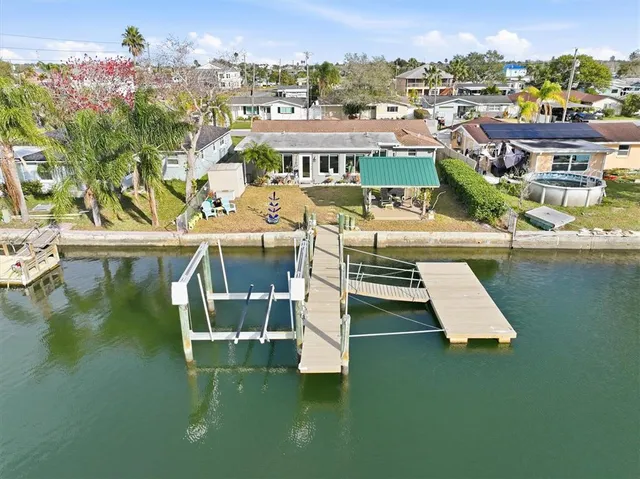 a front view of a house with a garden and yard