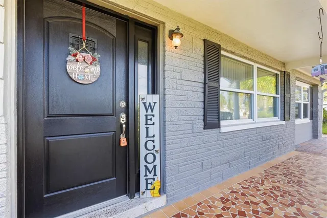 a view of a livingroom with furniture and a flat screen tv