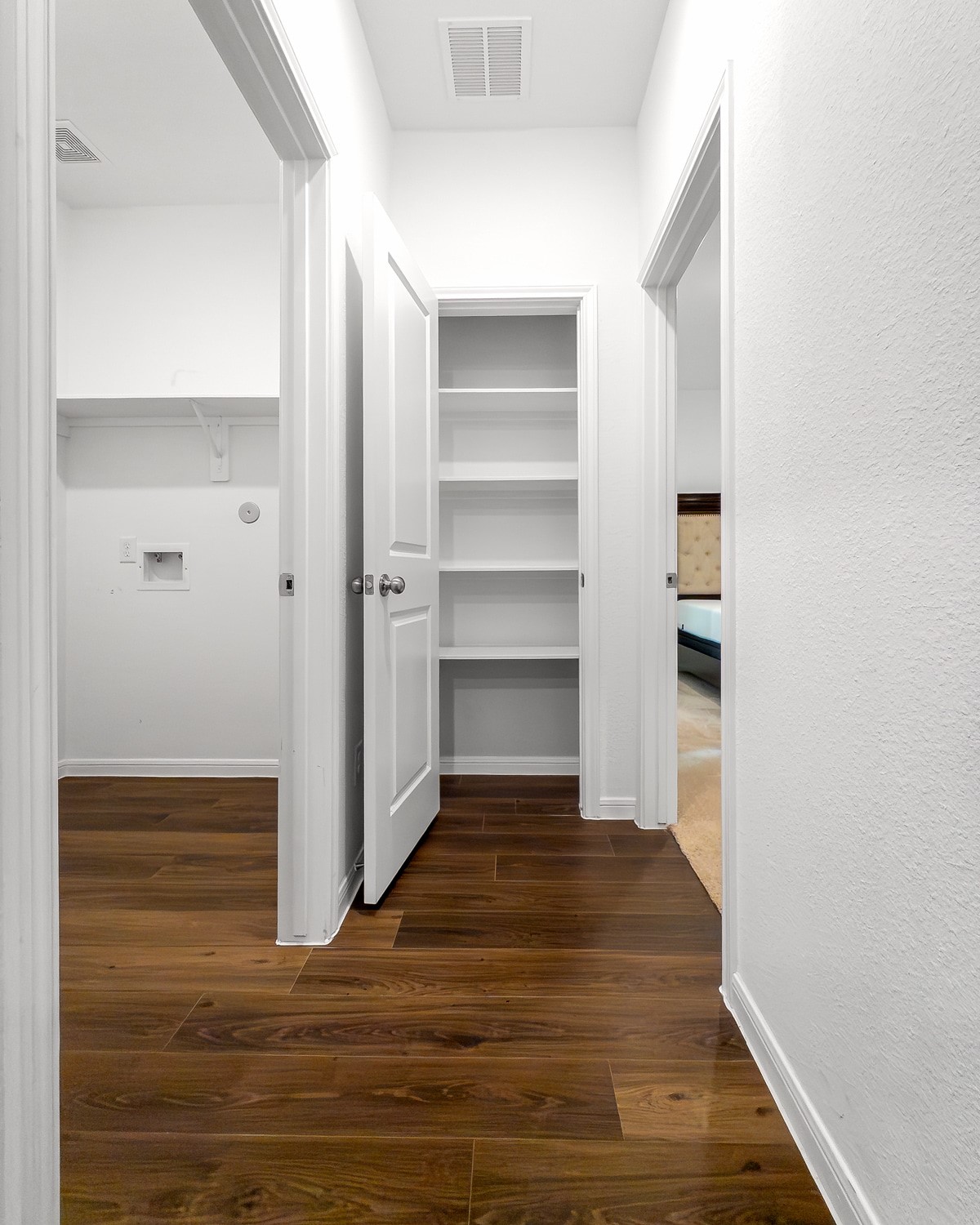 10222 Clearwick Street Houston, TX 77034 - Photo 19 of 24 Hallway towards Utility Room and Primary Bedroom