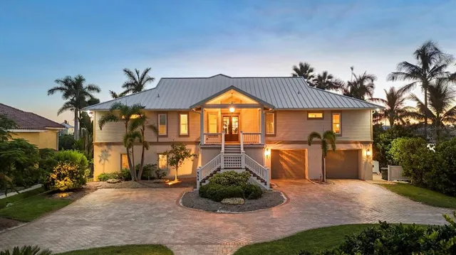 a living room with lots of furniture and a chandelier