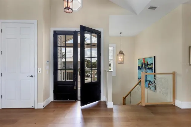 a living room with furniture a table and a large window