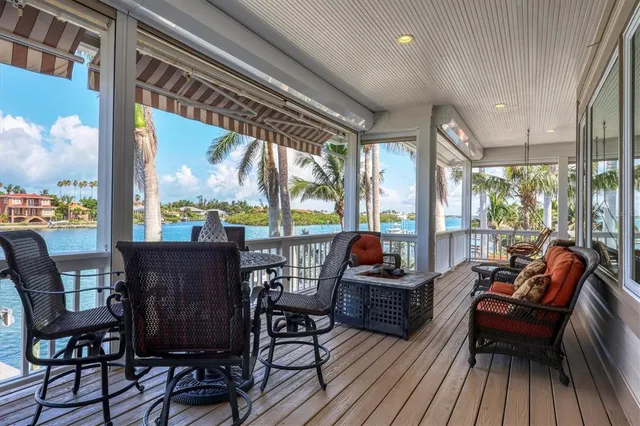 a kitchen with kitchen island granite countertop a sink a center island and cabinets