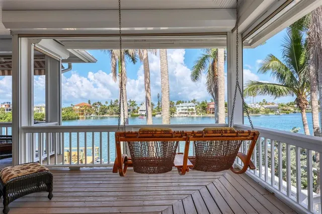 a kitchen with stainless steel appliances granite countertop a sink a stove and a wooden floors