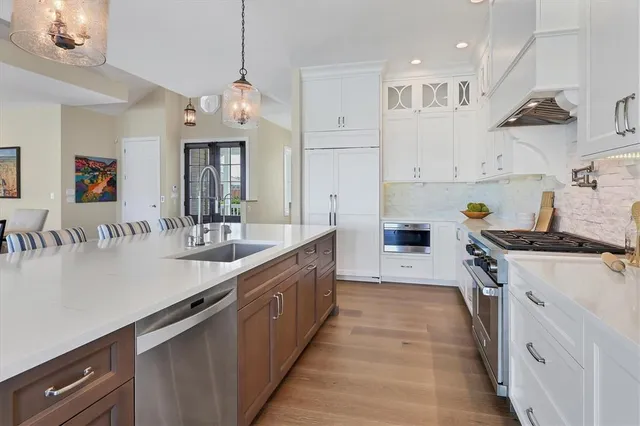 a living room with furniture a rug and a window