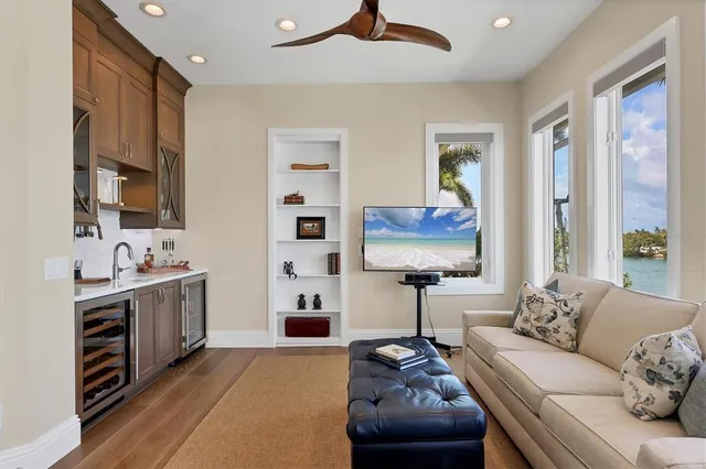a bedroom with a bed and ceiling fan