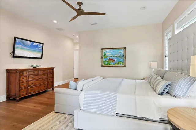 a bathroom with a granite countertop sink a mirror and shower
