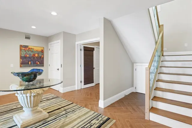 a view of a backyard with a garden and entertaining space