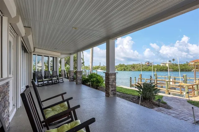 a kitchen with stainless steel appliances granite countertop a refrigerator sink and stove