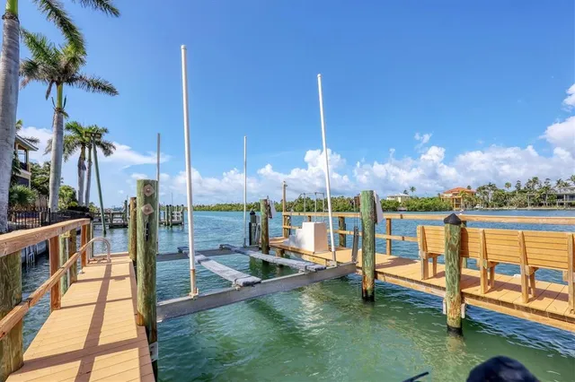 a bathroom with a granite countertop sink toilet a mirror and shower