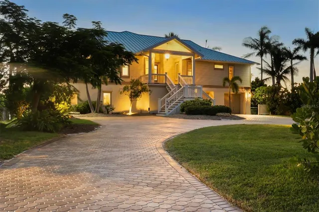 a front view of house with yard and seating area