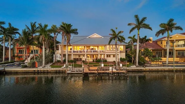 an aerial view of a houses with ocean view