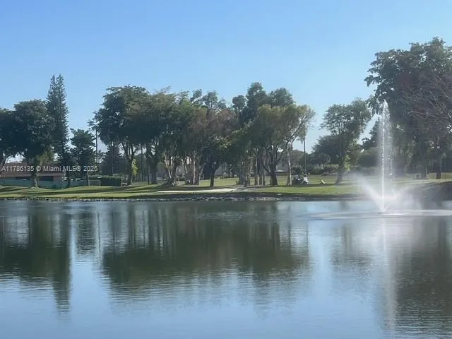 a swimming pool with outdoor seating and yard