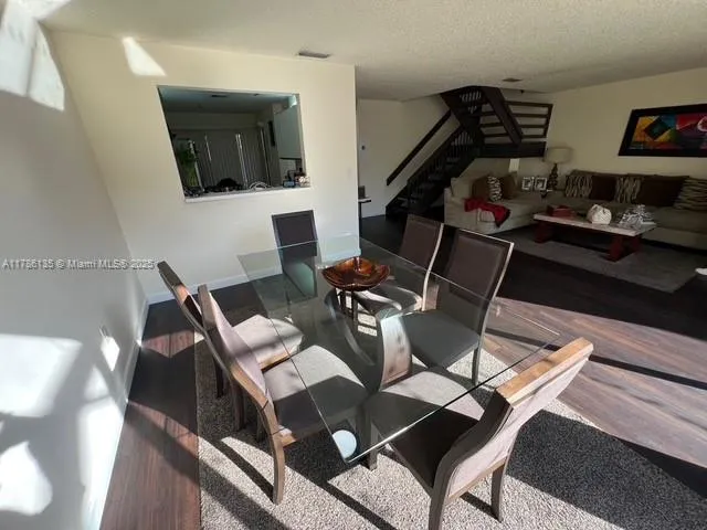 a kitchen with a stove a refrigerator and a sink