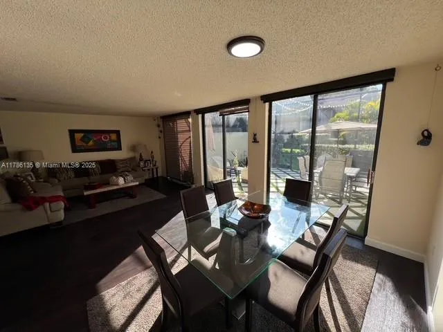 a bathroom with a sink and mirror with bathtub