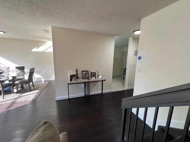 a bedroom with a bed and a television