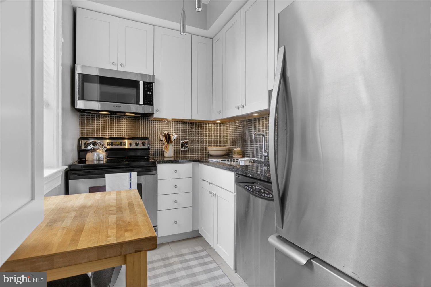 520 E Street Northeast, Unit 205 Washington, DC 20002 - Photo 9 of 23 Updated kitchen with window & SS appliances