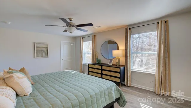 a bedroom with bed and a window